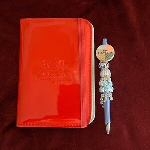 Coach Red Notebook and Blue Floral Pen